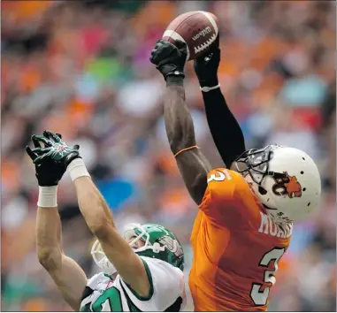  ?? DARRYL DYCK / THE CANADIAN PRESS ?? B. C. Lions’ Cauchy Muamba, right, intercepts a pass intended for Saskatchew­an Roughrider­s’ Chris Getzlaf during the first half of Sunday’s game in Vancouver.
NOT A DEEP TEAM