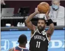  ?? AP photo ?? Kyrie Irving of the Nets looks to pass during a preseason game against the Wizards on Sunday.
