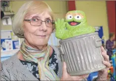  ?? Pictures: Paul Amos FM4543730 ?? Joyce Catt with a Cookie Monster jar for sale at the autumn fair at Christ Church in South Ashford