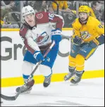  ?? Mark Humphrey The Associated Press ?? Colorado right wing Nicolas Aubekubel moves the puck ahead of Nashville’s Alexandre Carrier during the first period in Game 4 Monday.