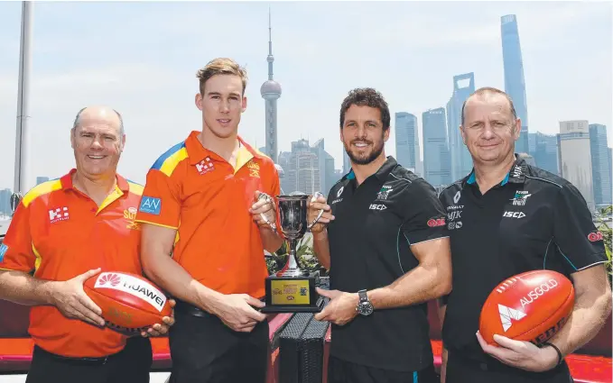  ?? Picture: AAP IMAGE/TRACEY NEARMY ?? Suns coach Rodney Eade, Suns captain Tom Lynch, Port Adelaide Power's Travis Boak and Power coach Ken Hinkley in Shanghai yesterday.