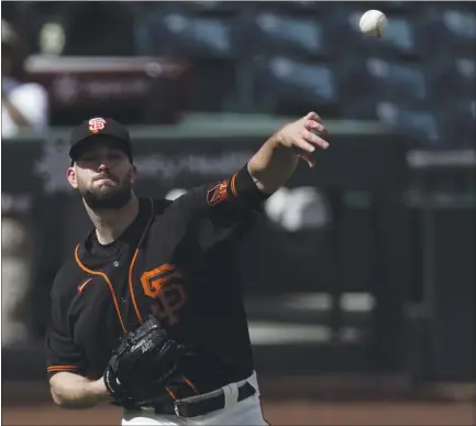  ?? ASHLEY LANDIS — THE ASSOCIATED PRESS ?? Alex Wood made his Giants spring training debut Thursday and pitched one hitless inning against the Chicago White Sox, recording one strikeout.