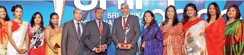  ??  ?? Srilankan Airlines CEO Suren Ratwatte and Head of Human Resources Pradeep Kekulawala with Srilankan staff at the award ceremony