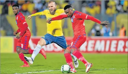  ?? Picture: GALLO IMAGES ?? PUSH FOR GLORY: Mamelodi Sundowns striker, the bearded Jeremy Brockie, tries to close down Morgan Gould of SuperSport United during their league match at the Lucas Moripe Stadium in Pretoria on Saturday night