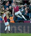  ??  ?? Marko Arnautovic celebrates his winner for West Ham as they upset the defending champions.