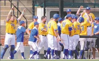  ?? Submitted photo ?? GAC CHAMPIONS: Southern Arkansas redshirt sophomore Zach Muldoon, left, celebrates with his teammates a week ago as the Muleriders scored 13 runs in the sixth inning for a decisive 16-3 lead in the GAC tournament final against Oklahoma Baptist at David...