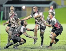  ?? Picture: MARK ANDREWS ?? MUD-BATH: Border Rugby Women’s Nomaphelo Mayongo charges forward in their clash with EP at Buffalo City Stadium on Saturday. Border won 47-10.
