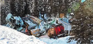  ?? GAVIN YOUNG ?? A CP Rail train derailed near Field early on Monday, killing three crew members as the train crashed into the Kicking Horse River.
