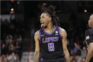  ?? (AP photo/young Kwak) ?? Grand Canyon guard Collin Moore celebrates his basket against Saint Mary’s Friday during the second half of a first-round college basketball game in the men’s NCAA Tournament in Spokane, Wash.