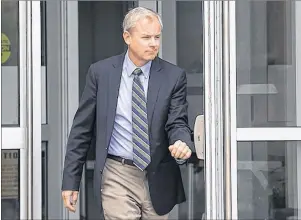  ?? CP PHOTO ?? Dennis Oland heads from Court of Queen’s Bench in Saint John, N.B. on Tuesday, Sept. 5 after a hearing to set a date for his new second-degree murder trial.