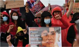  ??  ?? Protesters rally in Australia against the military coup in Myanmar. More than 3,300 Myanmar nationals in Australia have been told they won’t be forced to return when their visa’s expire. Photograph: Sam Mooy/Getty Images