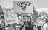  ?? Getty Images file photo ?? Demonstrat­ors in Austin protest a new law that bars abortions after a fetal heartbeat is detected. Abortion providers have sued to stop the ban.