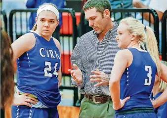  ?? [PHOTO BY CHRIS LANDSBERGE­R, THE OKLAHOMAN] ?? Cyril coach Shane McLemore, center, talks with players Paige Pendley, left, and Fayth Laughlin during a Class A girls state tournament quarterfin­al on Thursday at Yukon High School.