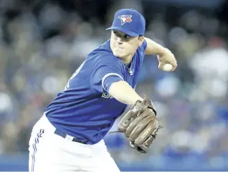  ?? POSTMEDIA NETWORK FILES ?? Toronto Blue Jays’ pitcher Aaron Loup throws the New York Yankees in April 2014. Over the last couple of seasons Loup had lost the trust of Jays’ manager John Gibbons, but with his solid season coming out of the bullpen, he has earned that trust back.