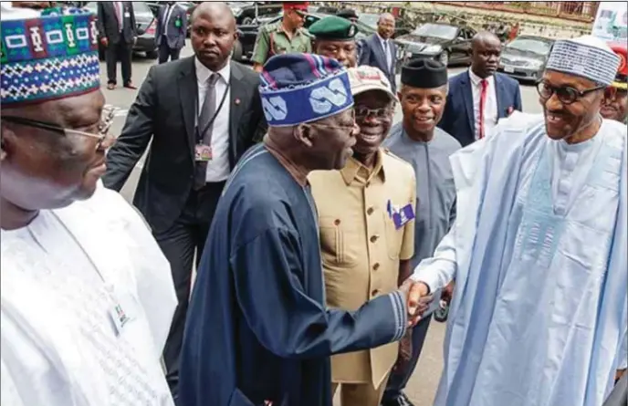  ??  ?? Buhari greets Tinubu after the party’s recent NEC, while the Vice-President, Yemi Osinbajo; National Chairman, Adams Oshiomhole and Senate Leader, Ahmed Lawan, watch in admiration