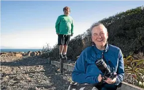  ?? ROSS GIBLIN/STUFF ?? Kedron Parker, with son Lorenzo, 11, at the spot where she was swamped by massive waves at O¯ whiro Bay during lockdown. Her camera was destroyed.