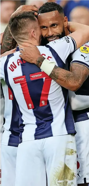  ?? ?? >>Albion goalscorer Kyle Bartley gets a hug from Jed Wallace