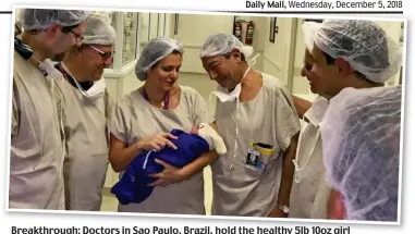  ??  ?? Breakthrou­gh: Doctors in Sao Paulo, Brazil, hold the healthy 5lb 10oz girl