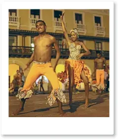  ?? REUTERS ?? Traditiona­l dancers perform on a square of the old city of Cartagena, Colombia, where the weather is good year-round.