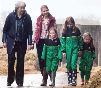  ??  ?? On the farm: With Susanne Jackson and her three girls in Northern Ireland