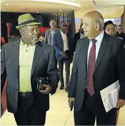  ?? Picture: Alon Skuy ?? The minister of public enterprise­s, Pravin Gordhan, right, and the chair of the Eskom board, Jabu Mabuza, arrive at a media briefing about SA’s load-shedding crisis, in Rosebank, Johannesbu­rg, this week.