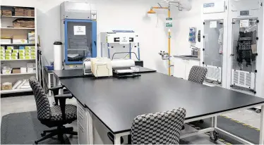  ?? Yi-Chin Lee / Staff photograph­er ?? The Houston Forensic Science Center now has a room, shown above, with electric cabinets designed to dry out wet evidence. The new lab will perform testing in seven discipline­s.