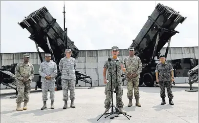  ?? Lee Jin-man ?? The Associated Press U.S. Pacific Command Commander Adm. Harry Harris Jr., center, answers questions Tuesday during a press conference at
Osan Air Base in Pyeongtaek, South Korea.