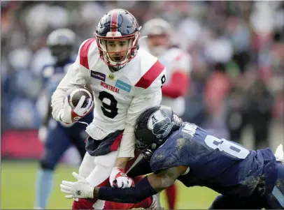  ?? ?? The Canadian Press
Montreal Alouettes wide receiver Jake Wieneke is tackled by Toronto Argonauts defensive back DaShaun Amos after making a catch during first half CFL Eastern Final football action in Toronto in November.