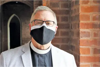  ?? STAFF PHOTO BY WYATT MASSEY ?? Brad Whitaker, rector of St. Paul’s Episcopal Church, stands in the church hallway on Thursday, more than two months after he publicly announced he was Hamilton County’s first COVID-19 case.