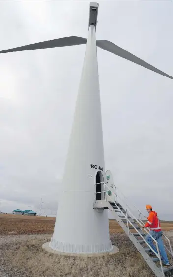  ?? TROY FLEECE/REGINA LEADER-POST ?? Darrell Crooks, operations manager Centennial Wind Power heads into a wind turbine near Swift Current on Friday. Clean emissions and scalabilit­y are wind power’s biggest advantages, he says.