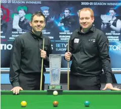  ?? RIGOUR ?? Final call: Antrim’s Jordan Brown (right) with Ronnie O’sullivan at the start of the Welsh Open Final yesterday