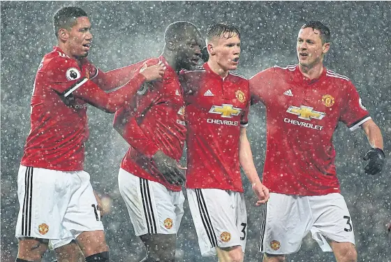  ??  ?? Manchester United’s Romelu Lukaku, second left, celebrates with teammates after scoring against Bournemout­h.