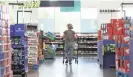  ?? JOE RONDONE/THE COMMERCIAL APPEAL ?? A shopper walks the aisles at Save-a-lot grocery store in the Binghampto­n Gateway Center.