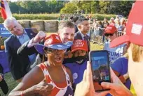  ?? NELL REDMOND AP ?? Eric Trump, the president’s son, poses with supporters after speaking at a campaign rally in Monroe, N.C.