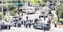  ?? PHOTO: TNS ?? The scene outside the Capital Gazette newspaper office and newsroom, with heavy police, fire, and rescue presence yesterday in Annapolis, Maryland.