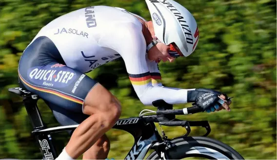  ??  ?? World champion Tony Martin’s skinsuit is near wrinkle-free in his TT position