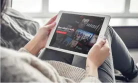  ?? Photograph: Tetiana Vitsenko/Alamy ?? iPads are great for watching Netflix, as well as video calls and games.