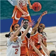  ??  ?? Kyra Lambert, right, and the Longhorns earned a famous fan in Drake after Sunday’s Sweet 16 victory.