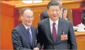  ?? REUTERS ?? Chinese President Xi Jinping (right) shakes hands with newly elected Chinese Vice President Wang Qishan at the plenary session of the National People's Congress.