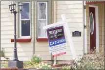  ?? (AP) ?? This file photo shows a real estate company sign that marks a home for sale in Harmony, Pennsylvan­ia. US new home sales plunged 15.4% in March as the lockdowns that began in the middle of the month began to
rattle the housing market.