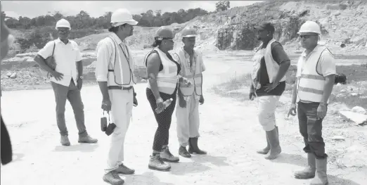  ?? (DPI photo) ?? Minister Simona Broomes (fourth from right) and GGMC staff inspecting BK’s Quarry