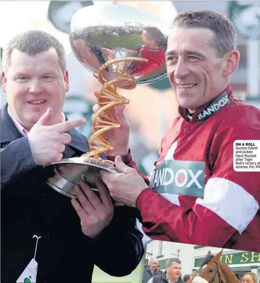  ??  ?? ON A ROLL Gordon Elliott and jockey Davy Russell after Tiger Roll’s victory at Aintree. Pic: PA