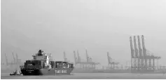  ??  ?? A cargo ship approaches the terminal at Port Klang, near Kuala Lumpur. — Reuters photo