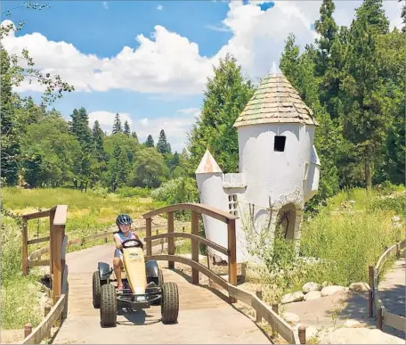  ?? Photograph­s by Rosemary McClure ?? SANTA’S VILLAGE near Lake Arrowhead has reopened as an adventure park for the energetic, with pedal racers, bike trails and more.