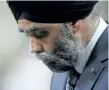  ?? ADRIAN WYLD/THE CANADIAN PRESS ?? Defence Minister Harjit Sajjan bows his head during question period in the House of Commons on Parliament Hill in Ottawa on Tuesday.