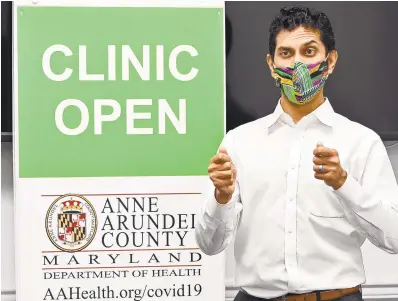  ?? JEFFREY F. BILL/CAPITAL GAZETTE PHOTOS ?? Anne Arundel County Health Officer Dr. Nilesh Kalyanaram­an explains the significan­ce of the Moderna COVID-19 vaccine Thursday.