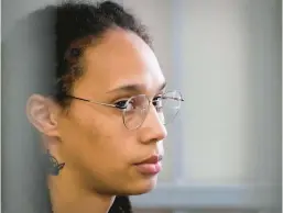  ?? ALEXANDER ZEMLIANICH­ENKO/AFP ?? WNBA superstar Brittney Griner sits inside a defendants’ cage before a hearing on Wednesday at the Khimki Court, outside Moscow.