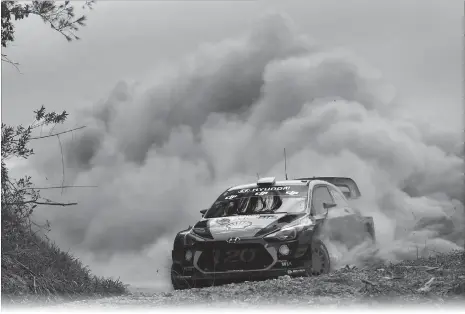  ?? Photo: AFP ?? Hyundai driver Andreas Mikkelsen of Norway powers through a corner on the first day of World Rally Championsh­ip event Rally Australia near Coffs Harbour on Friday.