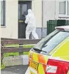  ??  ?? CLUES Police at the scene in Ballymena yesterday