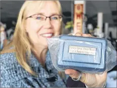  ?? MILLICENT MCKAY/JOURNAL PIONEER ?? Anna MacDonald, manager of the Salvation Army Thrift store, says it was a “fist-bump” moment when she was able to locate the owner of a memento urn that was accidental­ly donated to the store.